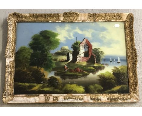 A Victorian reverse painted oil on glass, colourful panel depicting a fisherman by a church ruin. Gilt frame in need of atten