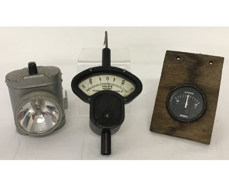 A vintage Mann Egerton volt meter. Together with an Ever Ready cycle lamp and a Lucas amp meter.