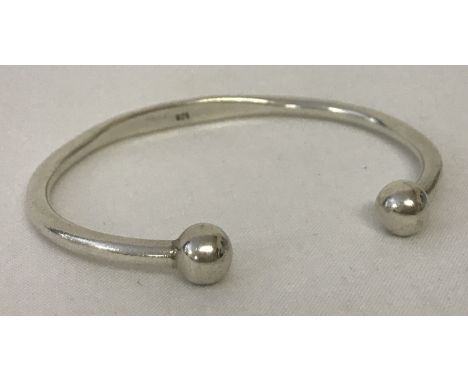 A modern silver torque style bangle. Marked with scales and 925 to inside. Total weight approx. 15.3g.