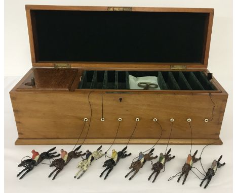 An early 20th Century, light oak cased, Jaques &amp; sons Mechanical Ascot The New Racing Game. Complete with 8 painted and s