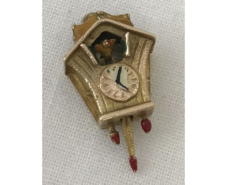 A 9ct gold cuckoo clock charm with coloured enamel detail. Total weight approx. 2.1g.