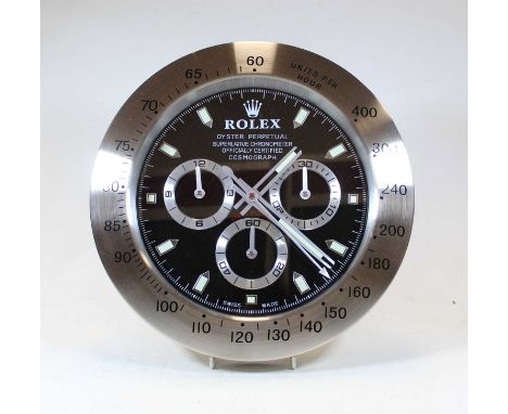 A brushed aluminium wall clock in the form of a Rolex Oyster Perpetual Superlative Chronometer Cosmograph wristwatch dial, bo
