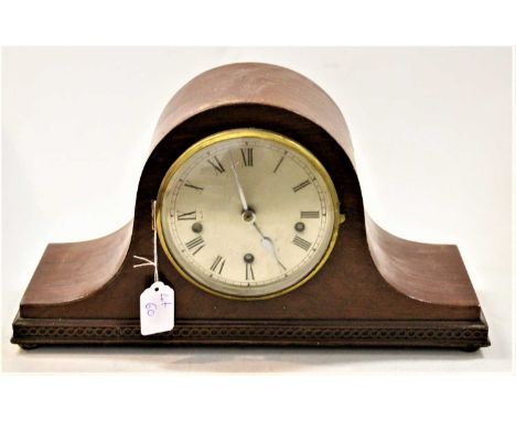 A 1920s mahogany cased mantel clock, having a silvered dial with Roman numerals and chiming movement, h.23cm