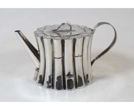 A silver teapot in the form of standing bamboo sticks, with later spout and handle, marks struck out by the Assay Office, 10.
