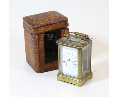 An early 20th century lacquered brass cased minuet carriage clock, having enamelled dial with Roman numerals, visible platfor