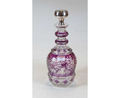 An amethyst overlaid and etched glass triple ring neck decanter, having white metal stopper, h.33cmCondition report: Conditio