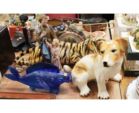 A large Italian porcelain model of a tiger in snarling pose, length 81cm, a large model of a seated dog, a Murano style blue 