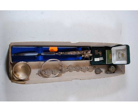 A collection of miscellaneous items, to include a coin bracelet set with eight half Franc coins, a silver napkin ring, silver