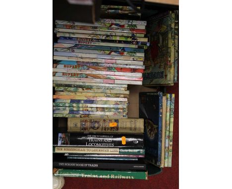 A collection of various books and annuals to include several Rupert the Bear annuals, and books mainly related to model railw