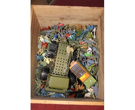 A box containing a collection of mainly plastic soldiers, and model military vehicles
