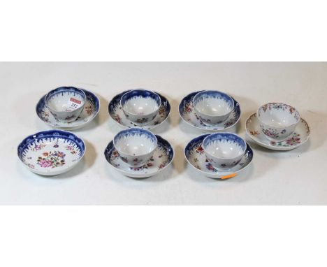 An early 19th century Newhall porcelain tea bowl and saucer, enamel decorated with flowers, together with a set of 6 probably