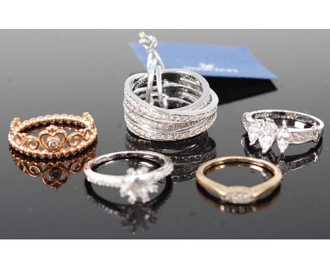 A 9ct gold small diamond three stone ring, 1.5g, size N; together with four various paste set dress rings (5)