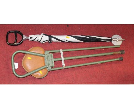 A green painted tubular metal folding shooting stick; together with an umbrella/shooting stick (2)