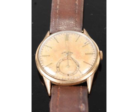 A gent's Movado 9ct gold cased mechanical watch, having signed champagne dial (badly tarnished) and subsidiary seconds dial, 