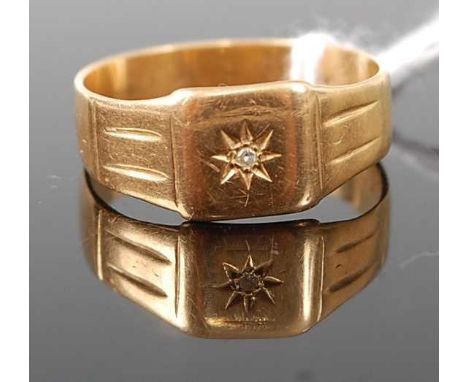 A yellow metal gent's band ring, 'gypsy' set with a small round cut diamond, stamped 18ct, 4.6g, size U