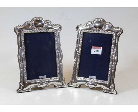 A pair of modern silver clad easel photo frames in the Art Nouveau style, 21x15cm