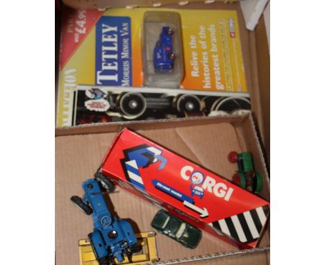 A box containing a small collection of diecast model vehicles to include a Corgi Jaguar XJ3