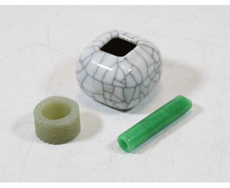 A spinach coloured jadeite pendant, of cylindrical form, length 6cm; together with a carved jade coloured ring; and a small c