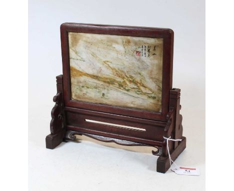 A Chinese table screen, the hardstone panel with Chinese script within a pierced hardwood stand, w.24cm