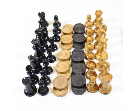 A turned boxwood and ebony chess set in the Staunton pattern; together with draughts pieces in mahogany boxCondition report: 