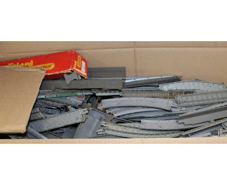 A collection of tin plated model locomotives and carriages, together with a large collection of Triang track and scenery