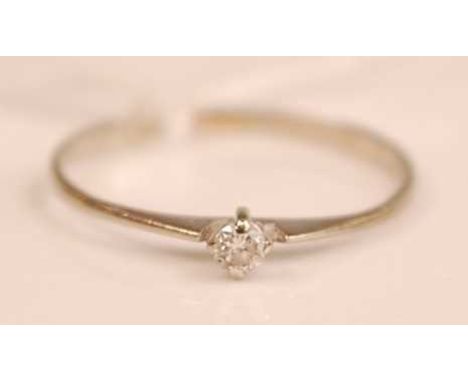 A 9ct white gold diamond solitaire ring, the claw set brilliant weighing approx 0.08 carats, 0.7g, size O/P