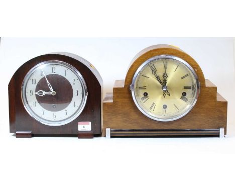An Enfield Royal Art Deco walnut cased mantel clock, having a silvered dial with Arabic numerals and chiming movement, h.22cm