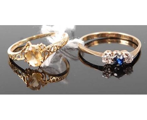 A 9ct gold, sapphire and diamond three stone ring, 1.3g, size O; together with a modern 9ct gold citrine set dress ring, 1g (