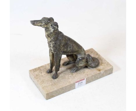 A spelter model of a wolf hound, in seated pose on grey rectangular marble plinth, h.19cm