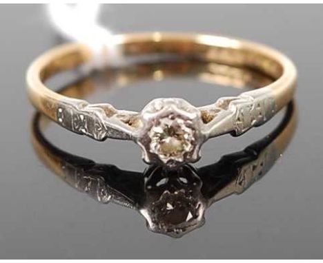 An 18ct gold diamond solitaire ring, the round cut diamond being in a white metal illusion crown setting, 2.6g, size S