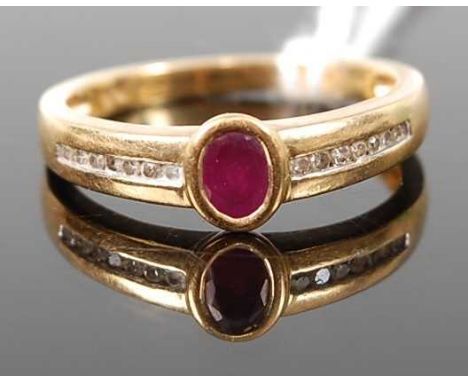 An 18ct gold, ruby and diamond point set dress ring, the oval cut ruby flanked to either side with seven channel set diamond 