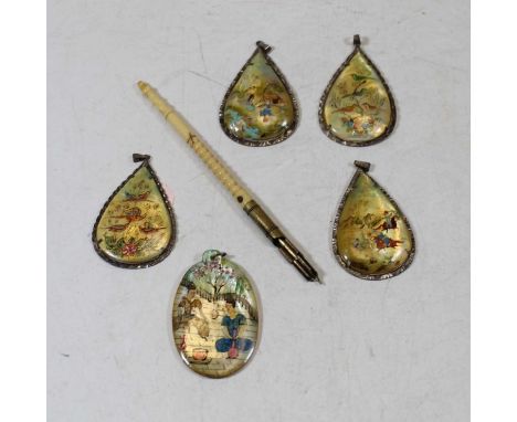 A set of four Japanese mother of pearl pear shaped pendants, each painted with figures within base metal surrounds; together 