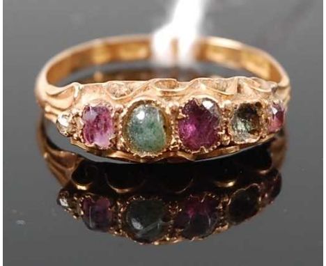 A vintage lady's 15ct gold multi-stone ring, set with alternating amethyst and emerald (one emerald missing and heavily worn)