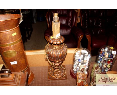 A gilt baluster table lamp in the form of a candlestick 