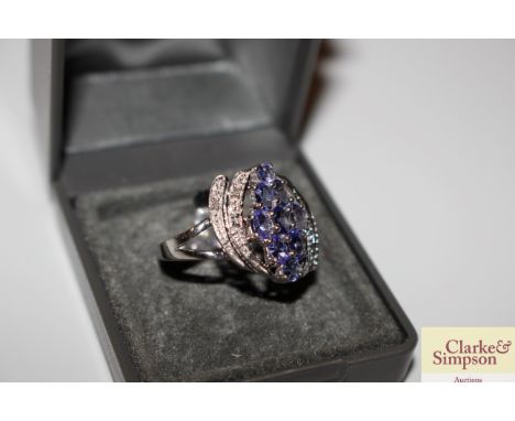 A Sterling silver diamond and tanzanite ring, 3.6gms, size O