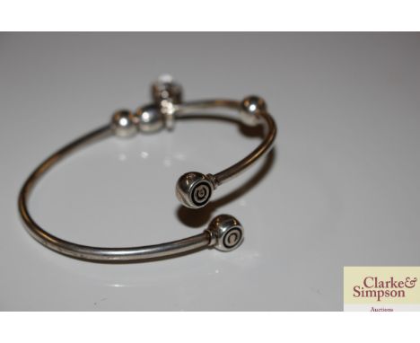 A Sterling silver torque bangle with owl charm, approx. 20gms 