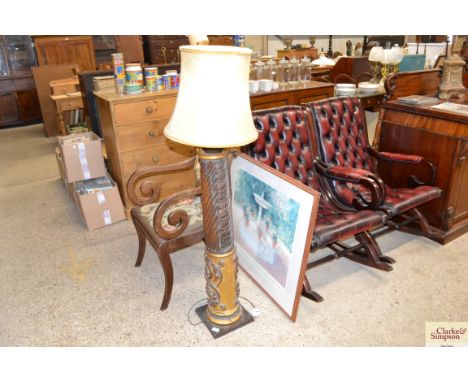 An Italian carved wooden and gilt wood lamp standard
