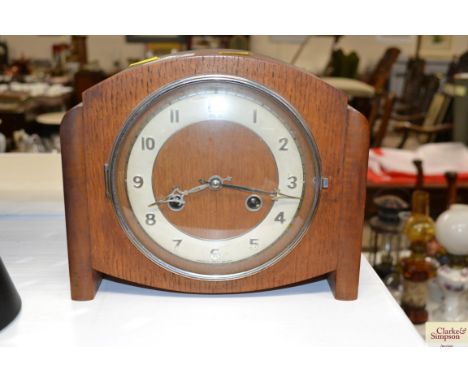 An oak cased two hole mantel clock 