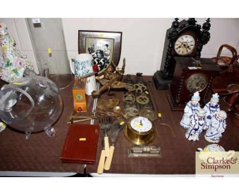 A collection of various metal ware including horse brasses, a steel flesh fork, a brass cased clock, desk top calendar, fish 