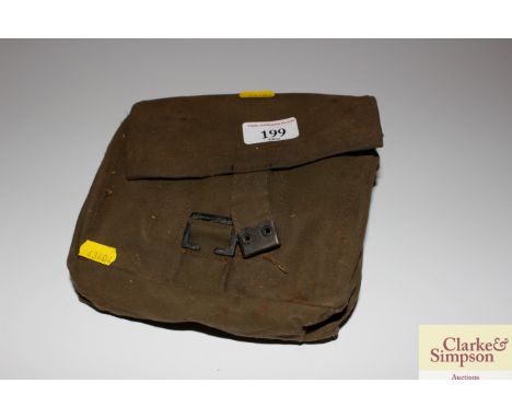 An army saw in canvas carrying bag