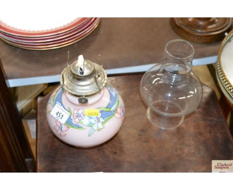 An opaque glass oil lamp