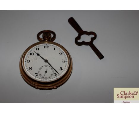 A gold plated pocket watch and a carriage clock key