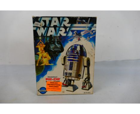 Star Wars - Kenner - A boxed Kenner R2-D2 plastic model kit. The kit is unbuilt and has loose parts and parts on sprues conta