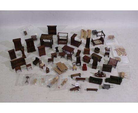 Dolls House Furniture - A collection of 30 plus items of modern unbranded wooden dolls house furniture including a Tudor cupb