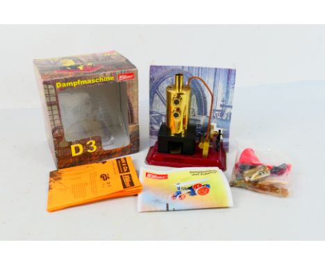 Wilesco - A boxed Wilesco Stationary Steam Engine # D3. It appears unused with the accessory bag still sealed, the bag of fue