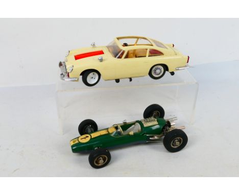 Gama - Schuco - 2 x clockwork cars, a Gama James Bond Aston Martin DB5 # 4900 and a Schuco Lotus F1 car # 1071. Both have som