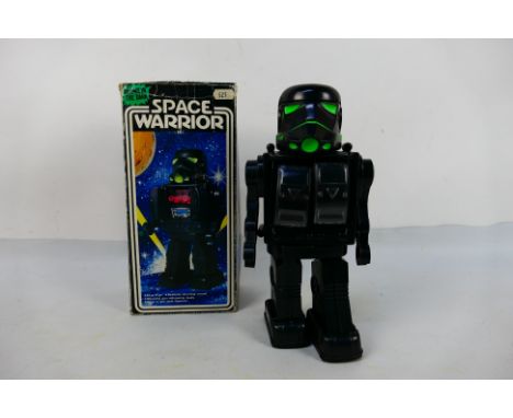 Star Wars - A Hong Kong made plastic "Space Warrior" battery operated robot. The robot appears to be a Star Wars 'Stormtroope