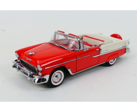 Franklin Mint - A 1955 Chevrolet Bel Air Convertible in 1:24 scale. The model appears Mint in its original polystyrene packag