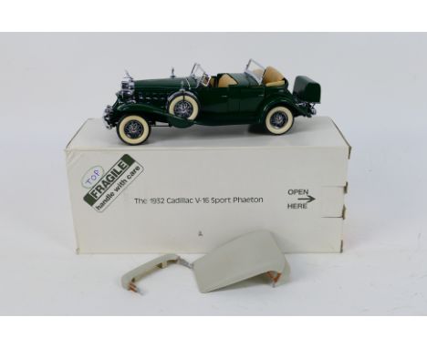 Franklin Mint - A boxed 1932 Cadillac V16 Sport Phaeton in 1:24 scale. The model appears Mint in its original packaging. (Thi