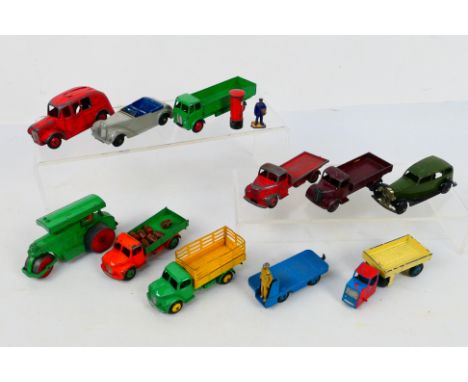 Dinky - A group of unboxed vehicles including Vauxhall saloon # 30d, Armstrong Siddeley # 38e, Forward Control Lorry # 420 an